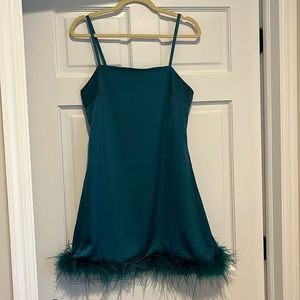 Cute satin skinny strap mini dress. Feathery bottom. Size M.